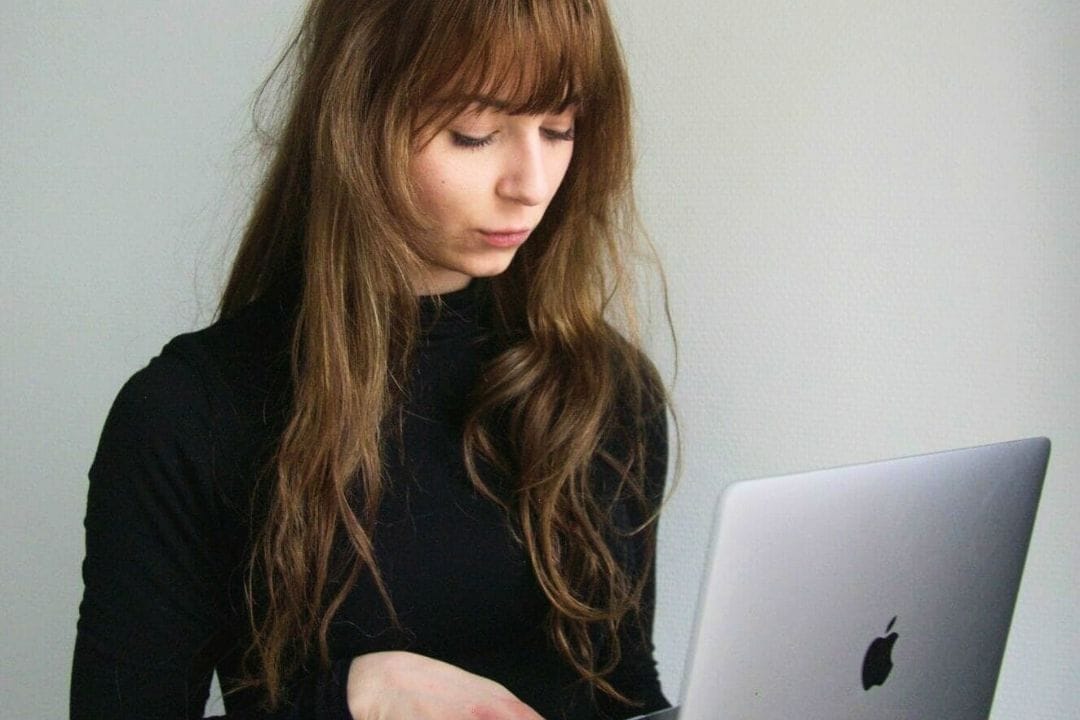 Woman on a macbook computer