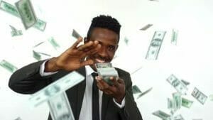 A image representing a professional with lots of money after successfully sourcing information technology jobs.