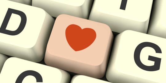 Heart Icon On Pink Computer Key Showing Love And Romance For Valentines Day