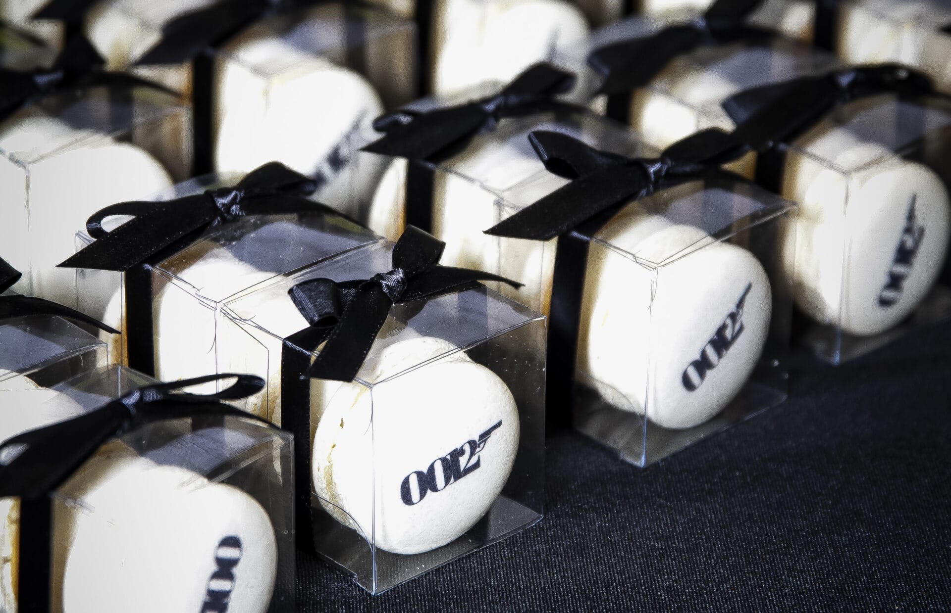 Macarons with License to Kill Risk logo and bow ties for May