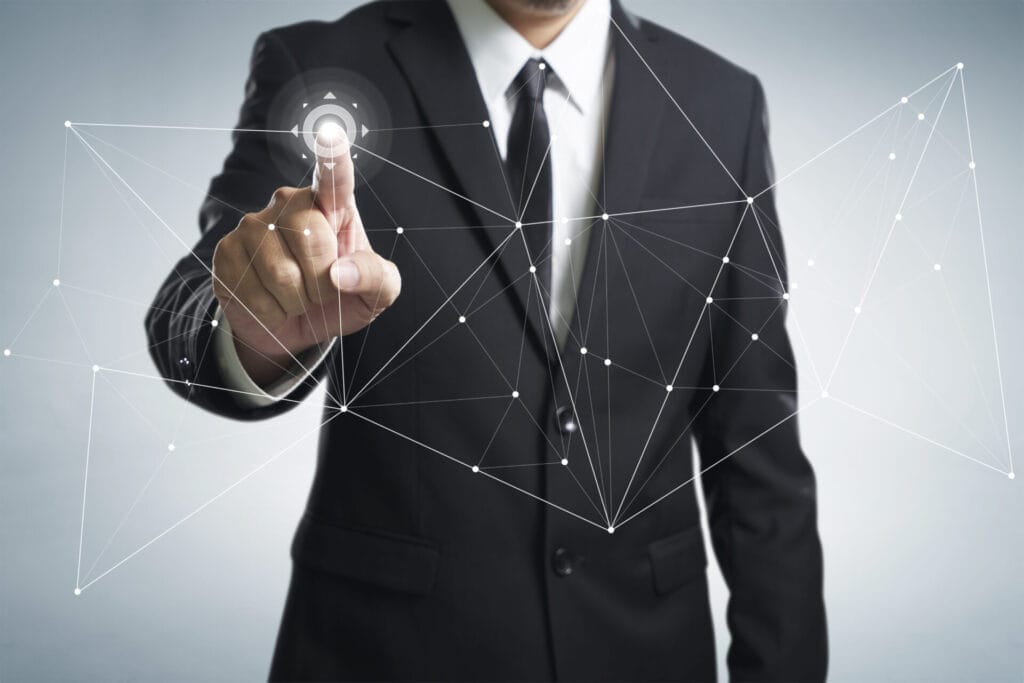 close up image of man wearing a suit touching an interactive screen