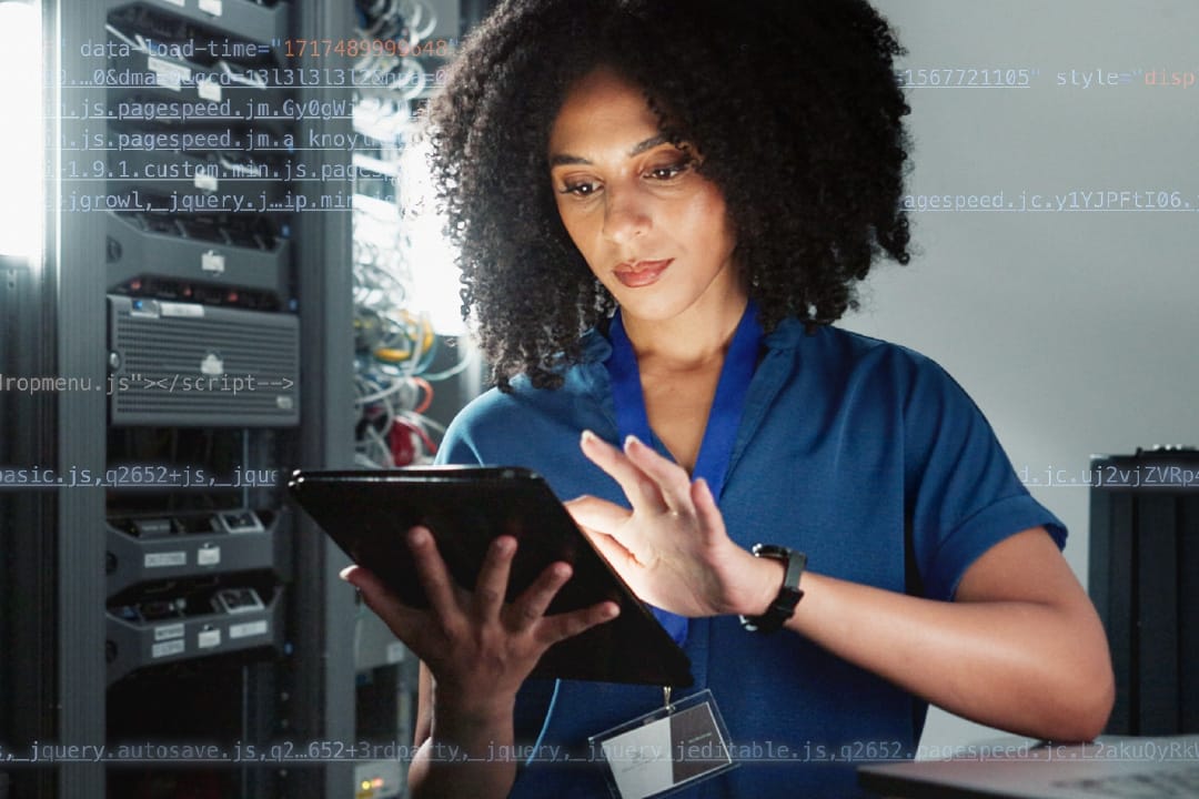 F12.Sovereign-Cloud-Services.woman-server-room Man working on a laptop at a home office