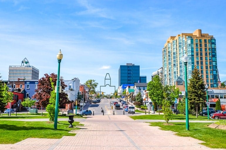 Woman walking down the street with a mobile device in Toronto, Canada