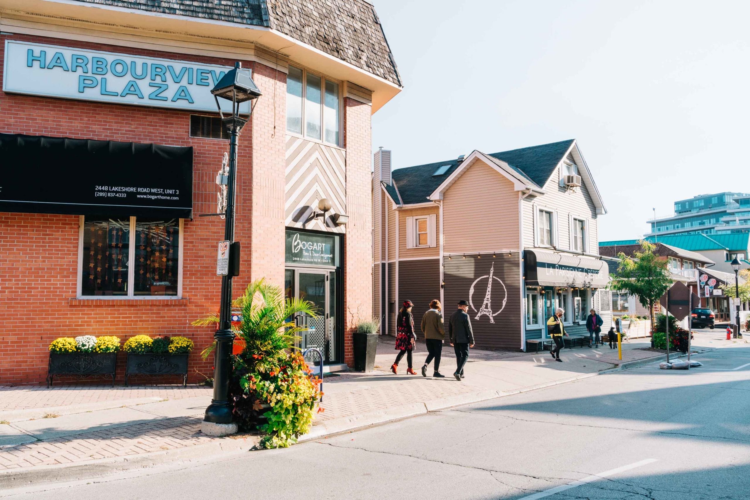 Woman walking down the street with a mobile device in Toronto, Canada