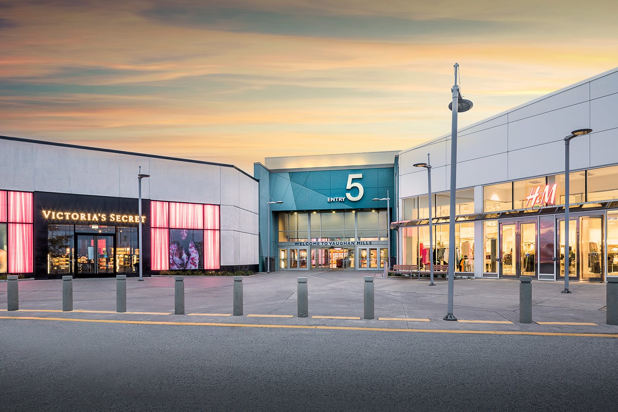 Woman walking down the street with a mobile device in Toronto, Canada