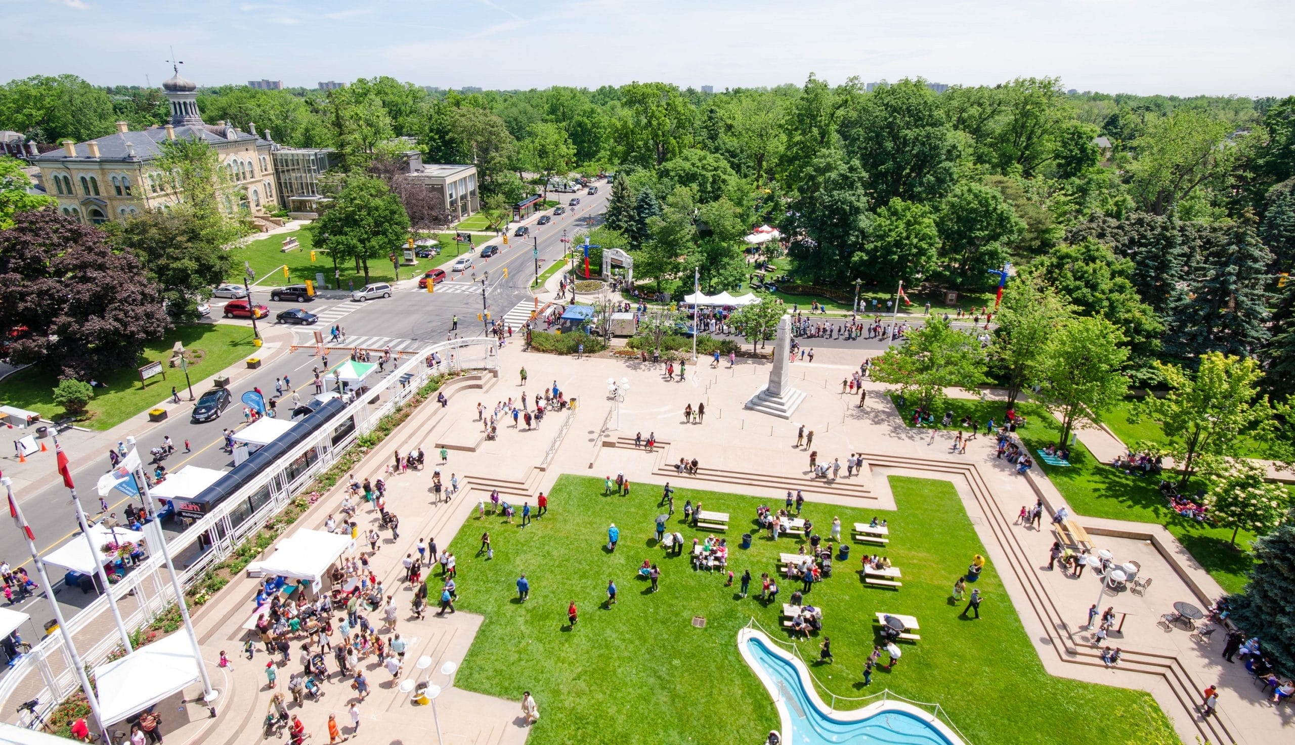 Woman walking down the street with a mobile device in Toronto, Canada