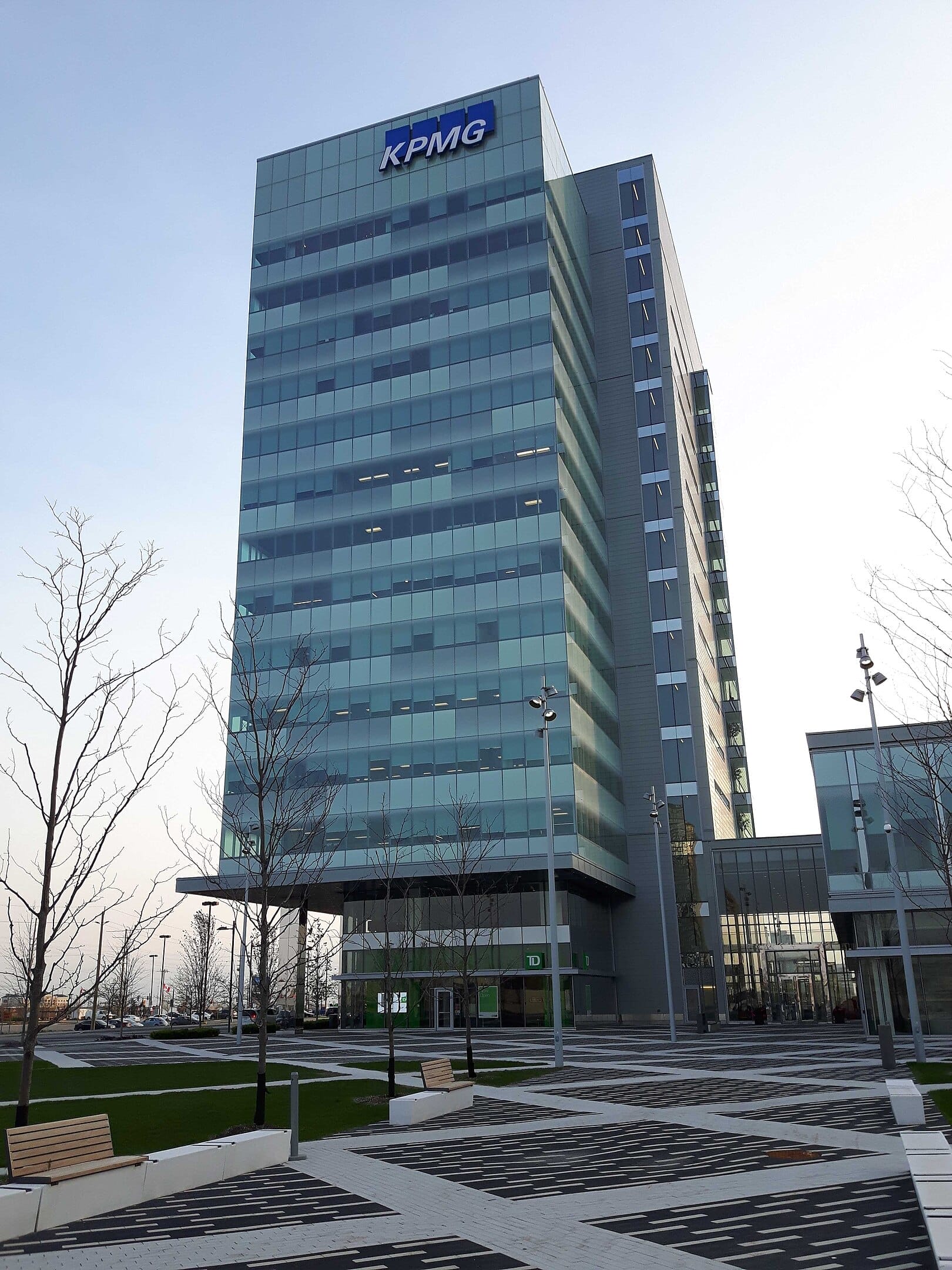 Woman walking down the street with a mobile device in Toronto, Canada