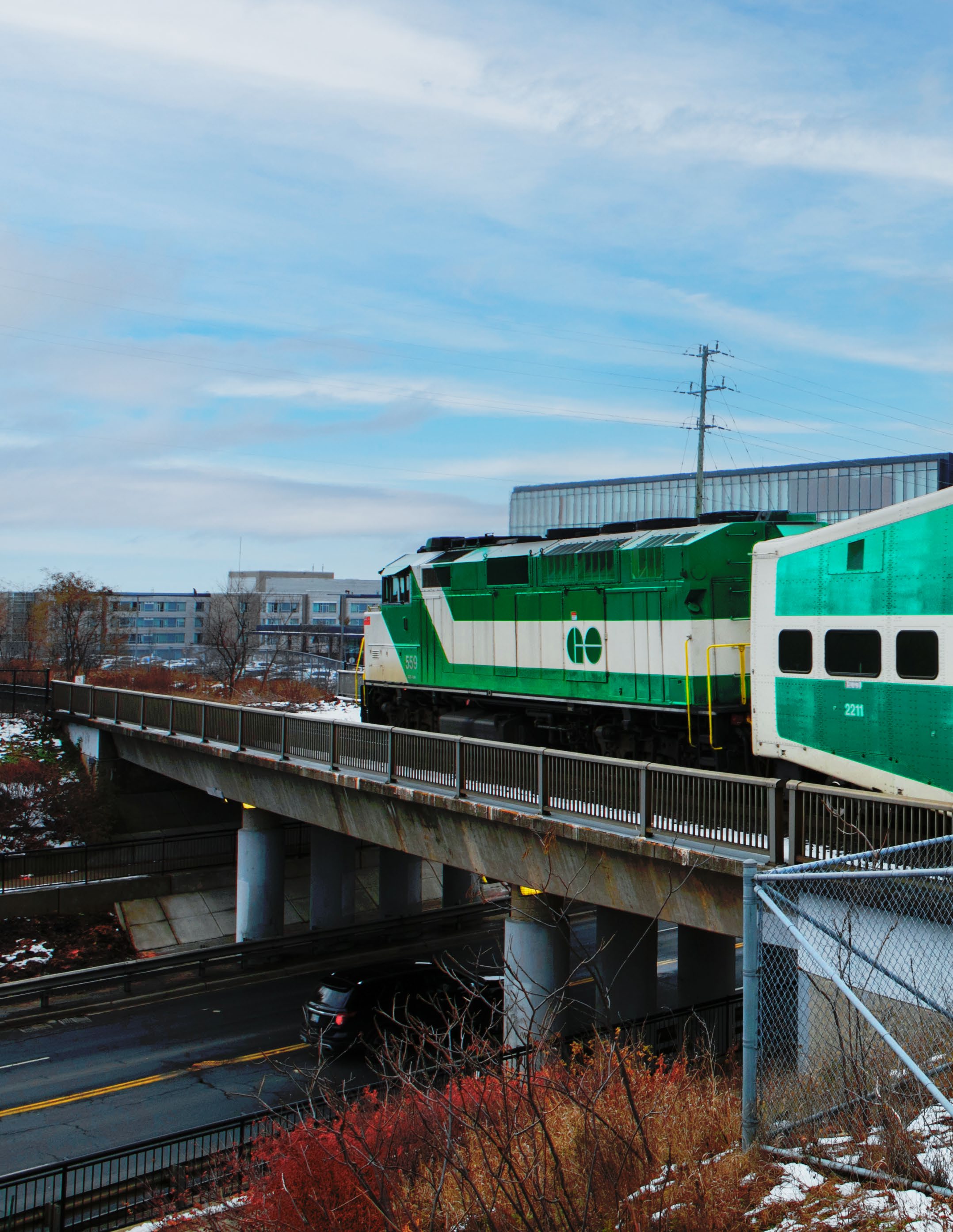 Woman walking down the street with a mobile device in Toronto, Canada